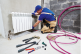 plumber at work  Connecting or repair water heating radiator